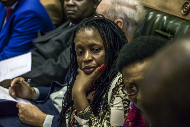 Zimbabwean Members of Parliament assemble for a parliamentary session where a motion is moved to impeach President Robert Mugabe on November 21, 2017 at the Zimbabwean Parliament in Harare, Zimbabwe. Zimbabwe's parliament prepared to start impeachment proceedings against President Robert Mugabe Tuesday, as ousted vice president Emmerson Mnangagwa, who could be the country's next leader, told him to step down. Further street protests have been called in Harare, raising fears that the political turmoil could spill into violence. / AFP PHOTO / Jekesai NJIKIZANA