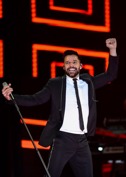 Puerto Rican musician Ricky Martin performs during a concert at the zocalo (main square) of Mexico City, on November 25, 2017. / AFP PHOTO / RONALDO SCHEMIDT