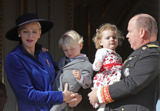 Prince Albert II of Monaco and his wife Princess Charlene hold their twins Prince Jacques and Princess Gabriella as they stand at the Palace Balcony during the celebrations marking Monaco's National Day, November 19, 2017. REUTERS/Eric Gaillard