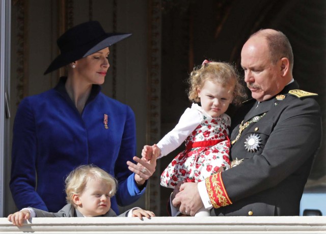 Prince Albert II of Monaco and his wife Princess Charlene hold their twins Prince Jacques and Princess Gabriella as they stand at the Palace Balcony during the celebrations marking Monaco's National Day, November 19, 2017. REUTERS/Eric Gaillard