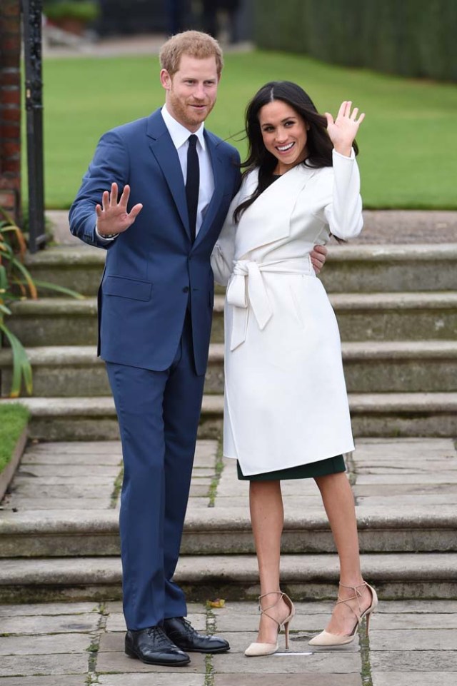 Britain's Prince Harry poses with Meghan Markle in the Sunken Garden of Kensington Palace, London, Britain, November 27, 2017. REUTERS/Eddie Mulholland/Pool