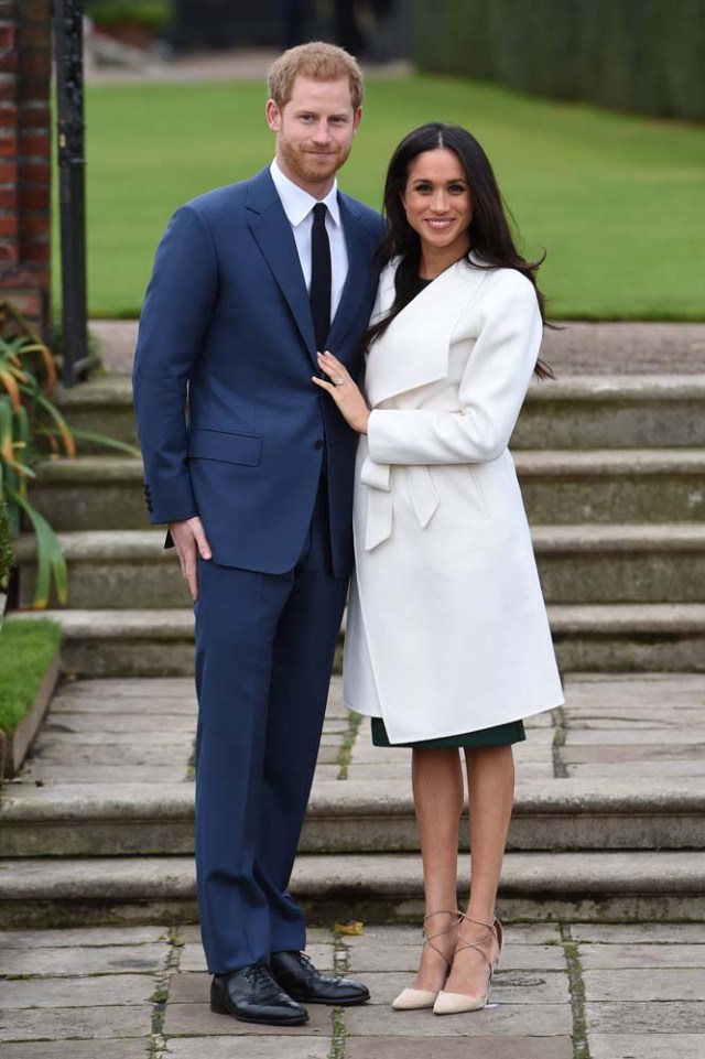 Britain's Prince Harry poses with Meghan Markle in the Sunken Garden of Kensington Palace, London, Britain, November 27, 2017. REUTERS/Eddie Mulholland/Pool