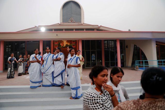 People gather at the Holy Rosary church as they prepare for the visit by Pope Francis in Dhaka, Bangladesh November 29, 2017. REUTERS/Damir Sagolj