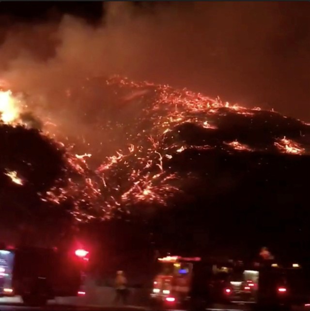 A wildfire burns in 405 highway in Los Angeles, California, U.S., December 6, 2017 in this picture obtained from social media. Instagram/Bethany Ellis/Handout via REUTERS   ATTENTION EDITORS - THIS IMAGE WAS PROVIDED BY A THIRD PARTY. MANDATORY CREDIT. NO RESALES. NO ARCHIVE