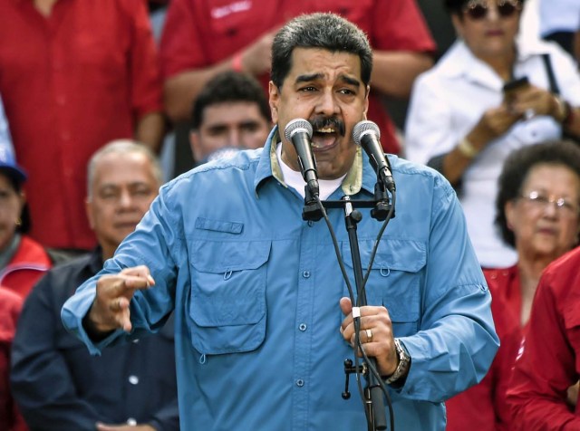 Venezuelan President Nicolas Maduro speaks during a public act in Caracas January 23, 2018. Venezuela's Maduro says he is ready to run for a second term. / AFP PHOTO / Juan BARRETO