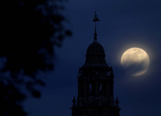 A blue moon rises over Balboa Park's California Tower in San Diego, California, U.S., January 30, 2018. REUTERS/Mike Blake