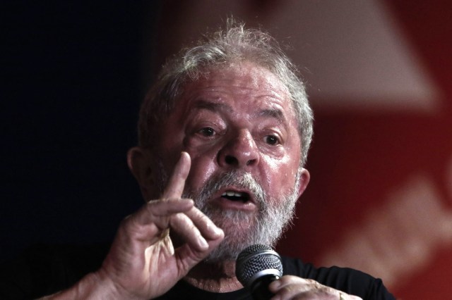 (FILES) This file photo taken on January 24, 2018 shows former Brazilian president Luiz Inacio Lula da Silva speaking during a rally in his support by trade unionists and members of social movements in Sao Paulo, Brazil. Brazilian President Michele Temer said on January 29, 2018 on a radio program that charismatic Lula is not dead politically despite his graft conviction was upheld by justice and his presidential candidacy is on stake. / AFP PHOTO / Miguel SCHINCARIOL