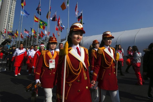 North Korean cheerleaders leave after a welcoming ceremony for North Korea's Olympic team at the Olympic Village in Gangneung on February 8, 2018, ahead of the Pyeongchang 2018 Winter Olympic Games. / AFP PHOTO / JUNG Yeon-Je