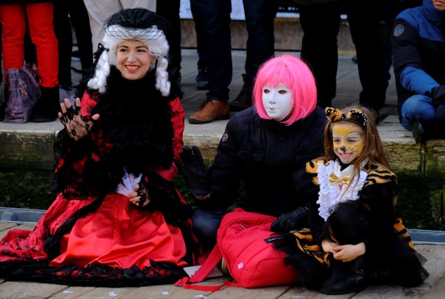 Masked revellers pose during the Carnival in Venice, Italy January 28, 2018. REUTERS/Manuel Silvestri