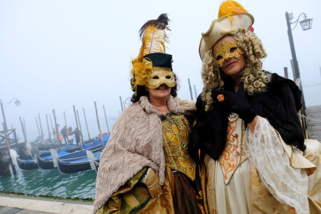 Masked revellers pose during the Carnival in Venice, Italy January 28, 2018. REUTERS/Manuel Silvestri