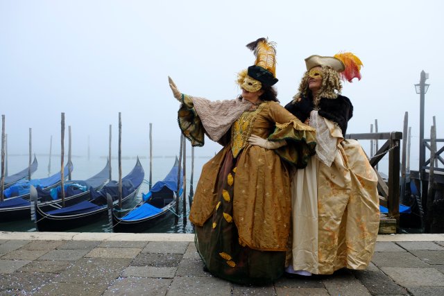 Masked revellers pose during the Carnival in Venice, Italy January 28, 2018. REUTERS/Manuel Silvestri