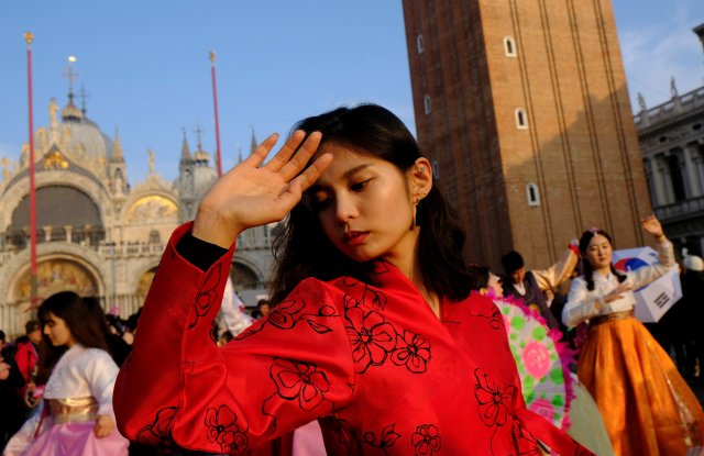 Dancers from South Korea perform during the Carnival in Saint Mark square in Venice, Italy January 28, 2018. REUTERS/Manuel Silvestri