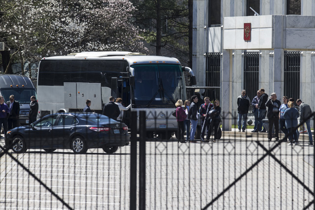 Russian diplomats expelled by the US after a nerve agent attack on a former spy, leave their embassy in Washington, D.C, March 31, 2018.   Along with the family members a total of 171 people will leave the United States on Saturday on two planes. / AFP PHOTO / ZACH GIBSON