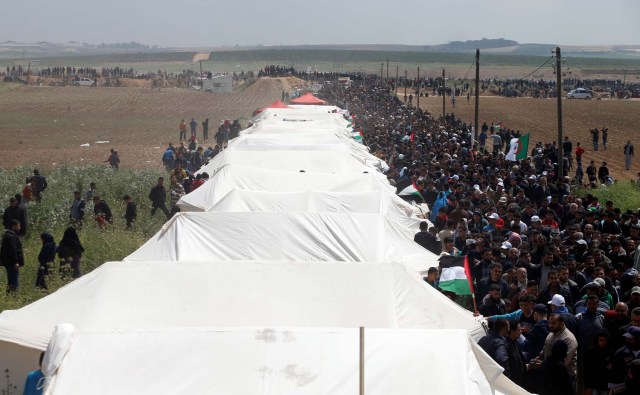 Palestinians attend a tent city protest along the Israel border with Gaza, demanding the right to return to their homeland, east of Gaza City March 30, 2018. REUTERS/Mohammed Salem