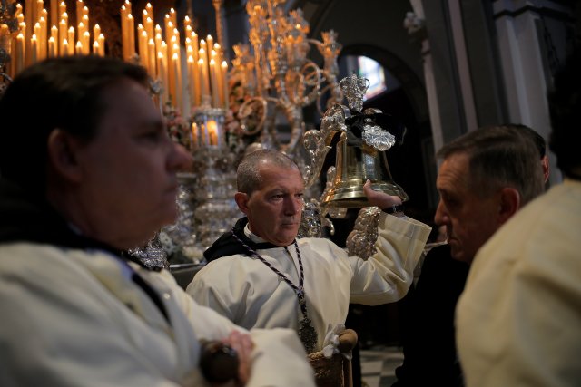 Spanish actor Antonio Banderas looks on inside a church before taking part as a penitent in the "Lagrimas and Favores" brotherhood, during a Palm Sunday procession in Malaga, Spain March 25, 2018. REUTERS/Jon Nazca