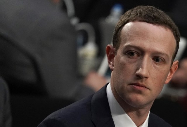 WASHINGTON, DC - APRIL 10: Facebook co-founder, Chairman and CEO Mark Zuckerberg testifies before a combined Senate Judiciary and Commerce committee hearing in the Hart Senate Office Building on Capitol Hill April 10, 2018 in Washington, DC. Zuckerberg, 33, was called to testify after it was reported that 87 million Facebook users had their personal information harvested by Cambridge Analytica, a British political consulting firm linked to the Trump campaign.   Alex Wong/Getty Images/AFP