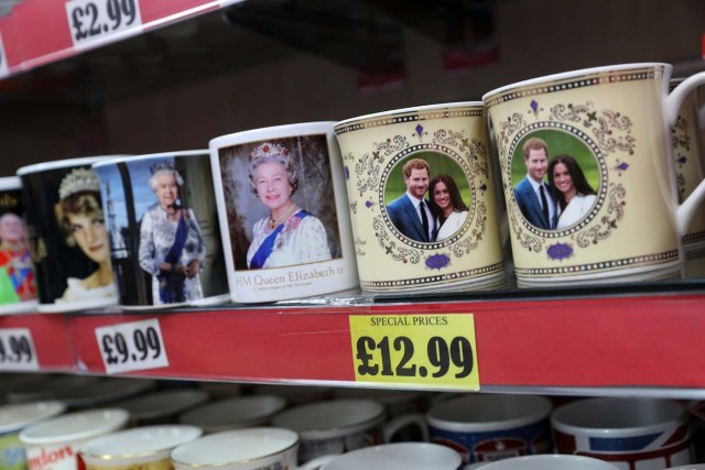 Souvenirs featuring Britain's Prince Harry and his fiancee Meghan Markle sit on display in a shop near Windsor Castle in Windsor, Britain, April 1, 2018. Picture taken April 1, 2018. REUTERS/Simon Dawson