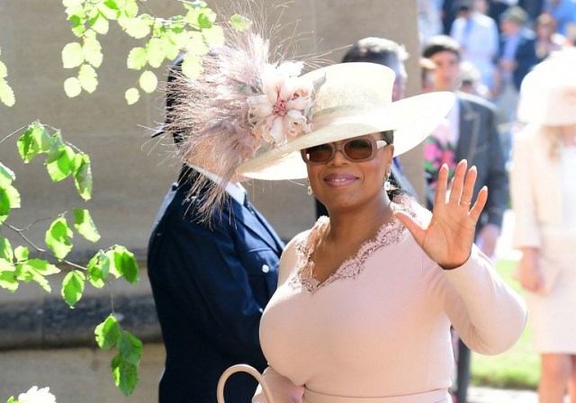 US presenter Oprah Winfrey arrives for the wedding ceremony of Britain's Prince Harry, Duke of Sussex and US actress Meghan Markle at St George's Chapel, Windsor Castle, in Windsor, on May 19, 2018. / AFP PHOTO / POOL / Ian West