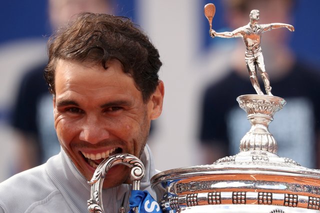 Tennis - ATP 500 - Barcelona Open - Real Club de Tenis Barcelona-1899, Barcelona, Spain - April 29, 2018   Spain's Rafael Nadal celebrates with the trophy after winning the final against Greece's Stefanos Tsitsipas   REUTERS/Albert Gea     TPX IMAGES OF THE DAY