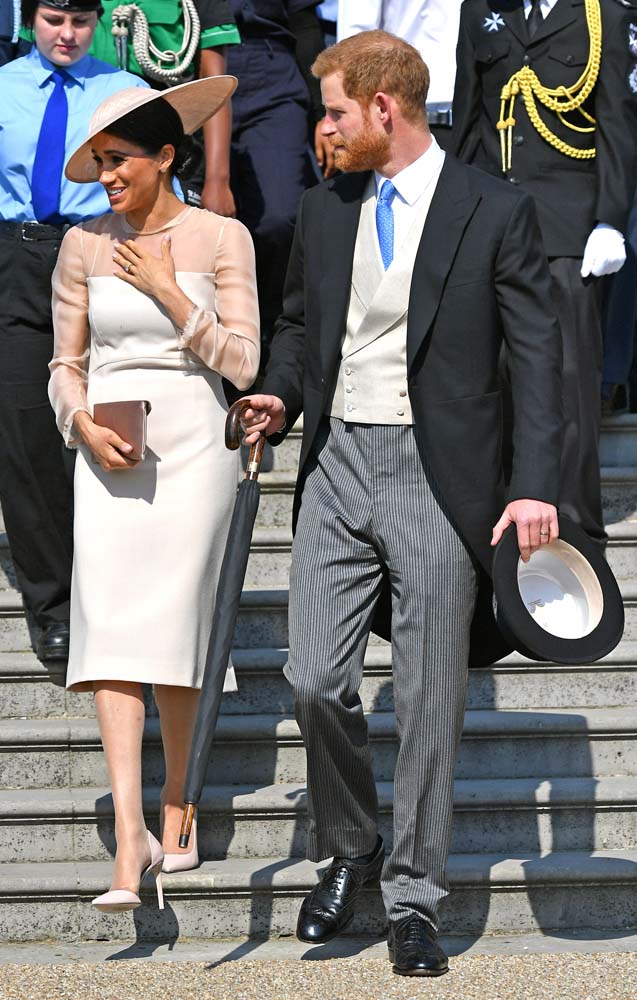 Britain'sÊPrince Harry and his wife Meghan, Duchess of Sussex attend a garden party at Buckingham Palace, their first royal engagement as a married couple, in London, May 22, 2018. Dominic Lipinski/Pool via Reuters