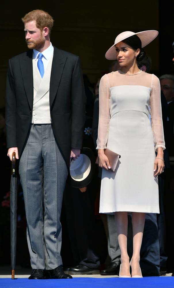 Britain'sÊPrince Harry and his wife Meghan, Duchess of Sussex attend a garden party at Buckingham Palace, their first royal engagement as a married couple, in London, May 22, 2018. Dominic Lipinski/Pool via Reuters