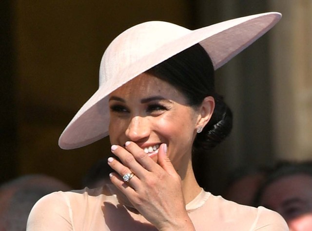 Meghan, Duchess of Sussex attends a garden party at Buckingham Palace, in London