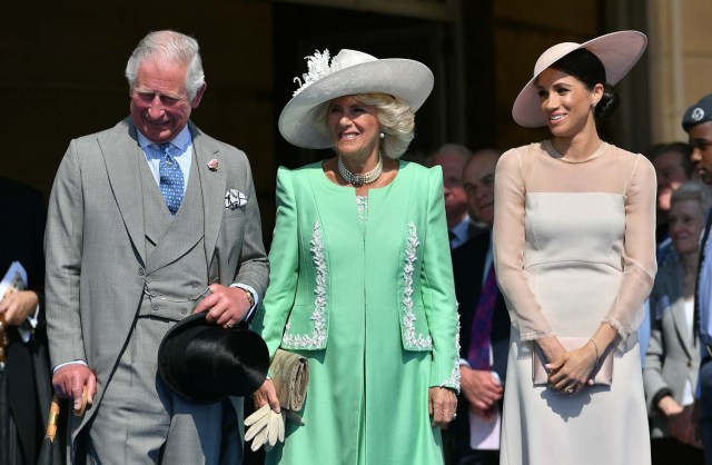 Meghan, Duchess of Sussex attends a garden party at Buckingham Palace, with Camilla the Duchess of Cornwall and Prince Charles, in London, Britain May 22, 2018. Dominic Lipinski/Pool via Reuters