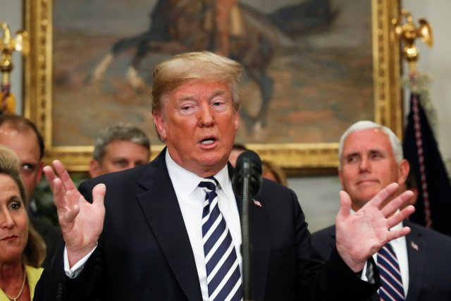 U.S. President Donald Trump gestures as he speaks before the signing ceremony for S. 2155 - Economic Growth, Regulatory Relief, and Consumer Protection Act in the Roosevelt Room at the White House in Washington, U.S., May 24, 2018. REUTERS/Kevin Lamarque