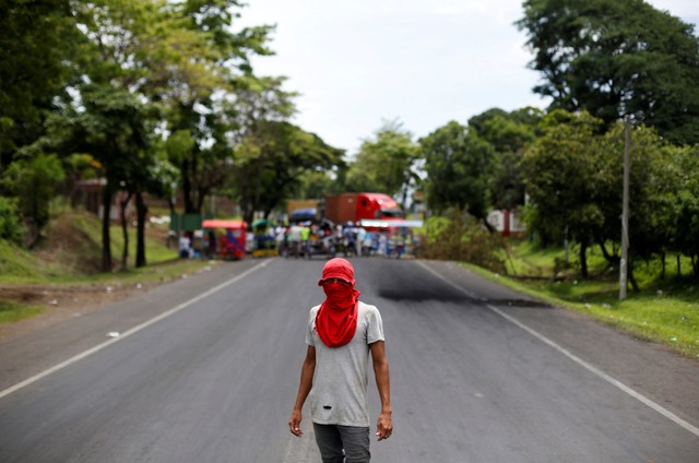 A demonstrator is pictured next to a barricade and a truck used as a roadblock during a protest against Nicaraguan President Daniel Ortega's government in Leon, Nicaragua June 7, 2018. REUTERS/ Jorge Cabrera